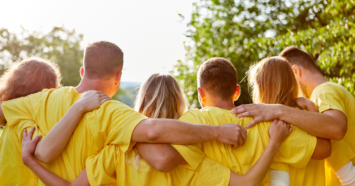 group of people embracing each other