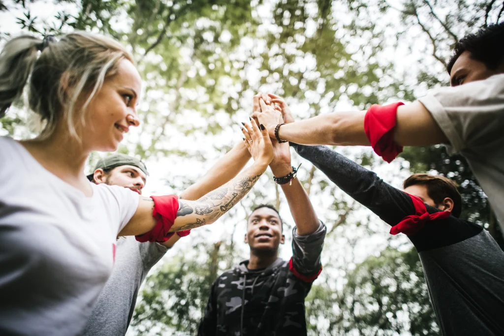 Team building Malaysia – diverse professionals collaborating during an outdoor retreat
