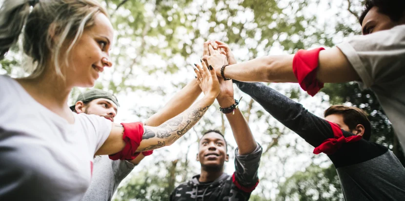 Team building Malaysia – diverse professionals collaborating during an outdoor retreat